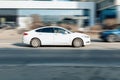 Car Ford Mondeo driving on freeway, side view. White sedan in motion Royalty Free Stock Photo