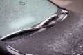 Car frozen windscreen and windscreen wipers after freezing rain