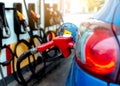 Car fueling at gas station. Refuel fill up with petrol gasoline. Petrol pump filling fuel nozzle in fuel tank of car at gas Royalty Free Stock Photo