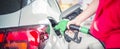 woman fueling gas in car at petrol station. Royalty Free Stock Photo