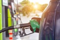 Car gas nozzle auto filling refuel fill up with premium petrol gasoline at gas station. Close up Royalty Free Stock Photo