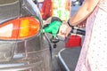 Pretty young woman refuel the car Royalty Free Stock Photo