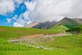 A car on the Georgian Military Highway, a beautiful mountain road of Georgia, the Caucasus