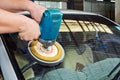 Car Glass polishing with power buffer machine Royalty Free Stock Photo