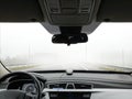 The car goes fast on the road in the fog, view from the passenger compartment