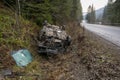 The Car Got Into an Accident on the Mountain Road and fell Upside Down. The Blue Car Turned over in a Ditch near the Royalty Free Stock Photo