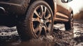 The car got stuck in wet mud. Close-up of a car wheel in the mud. Off-road after rain Royalty Free Stock Photo