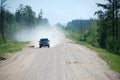 Car at gravel road Kolyma highway at Russia