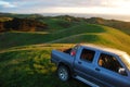 Car at green hill top rural area