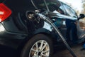 Car with gun in tank fueling on gas station Royalty Free Stock Photo