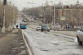 Car has to go around the pit on the road on the tram tracks