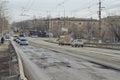 Car has to go around the pit on the road on the tram tracks