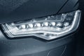 Car headlight in drops Royalty Free Stock Photo