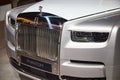 Car headlight and grille of Rolls-Royce Phantom series II Royalty Free Stock Photo