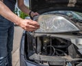 car headlight repair by replacing bad bulbs with new ones Royalty Free Stock Photo