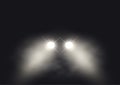 Car headlights in foggy atmosphere