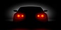 Car headlights shining in the dark back view Royalty Free Stock Photo