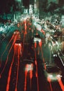 Car headlights and taillights on a city street at night