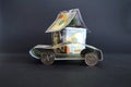 Car and house made of money. Royalty Free Stock Photo