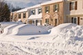 Car and houses after snowstorm Royalty Free Stock Photo