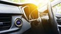 Car ignition start button illuminating on dashboard in vehicle interior, representing technology, beginning journey, and Royalty Free Stock Photo