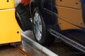 A car inside a car washing machine while it is working Royalty Free Stock Photo