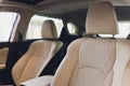 Car inside driver place. Interior of prestige modern car. Front seats with steering wheel dashboard. Beige cockpit with Royalty Free Stock Photo