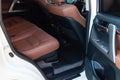 Car inside rear passenger place. Brown interior of prestige modern car. Front seats with steering wheel dashboard. After washing