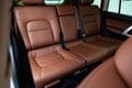 Car inside rear passenger place. Brown interior of prestige modern car. Front seats with steering wheel dashboard. After washing