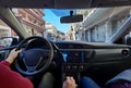 Car inside view from back seat while driver driving Royalty Free Stock Photo
