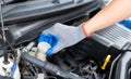 Car inspection and maintenance concept. Man checking brake fluid in engine room. Check car brake fluid for safe travel. Car Royalty Free Stock Photo