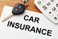 Car insurance with car key and calculator Royalty Free Stock Photo