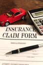 Car insurance claim form on desk Royalty Free Stock Photo