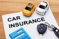 Car insurance concept on wood table Royalty Free Stock Photo