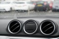 Car interior air vents three circular round on dashboard