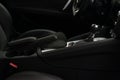 Car interior detail. Shift lever in modern sport car. Viev from passenger seat.