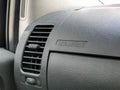 Car interior details. Car air conditioning vent and airbag icon on dashboard.