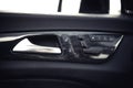 Car interior details. Door handle and electronic memory for the chairs. Royalty Free Stock Photo