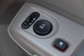 Car interior details of door handle with windows controls and adjustments Royalty Free Stock Photo