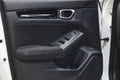 Car interior door panel detail. Door handle and mirror control Royalty Free Stock Photo