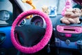 Car interior, with pink details.