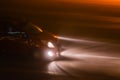 Car with its headlights in heavy fog of northern italy Royalty Free Stock Photo