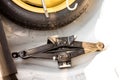 Car jack with stepney and wheel changing tool kit Royalty Free Stock Photo
