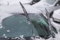 Car janitors are up. A man cleans his car from the snow. Heavy snowfall turned the car into a large snowdrift Royalty Free Stock Photo