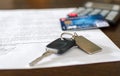 Car key, credit card on a signed sales contract Royalty Free Stock Photo