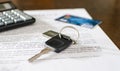 Car key, credit card on a signed sales contract Royalty Free Stock Photo