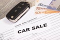 Car key, euro banknotes and vehicle sales agreement. Inscription car sale. Sales and buying new or used car Royalty Free Stock Photo