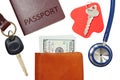 Car key, house key, passport and stethoscope with money in wallet Royalty Free Stock Photo