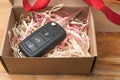 Car key in a paper box with red bow Royalty Free Stock Photo