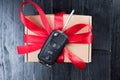 Car key on a paper box with red ribbon bow Royalty Free Stock Photo